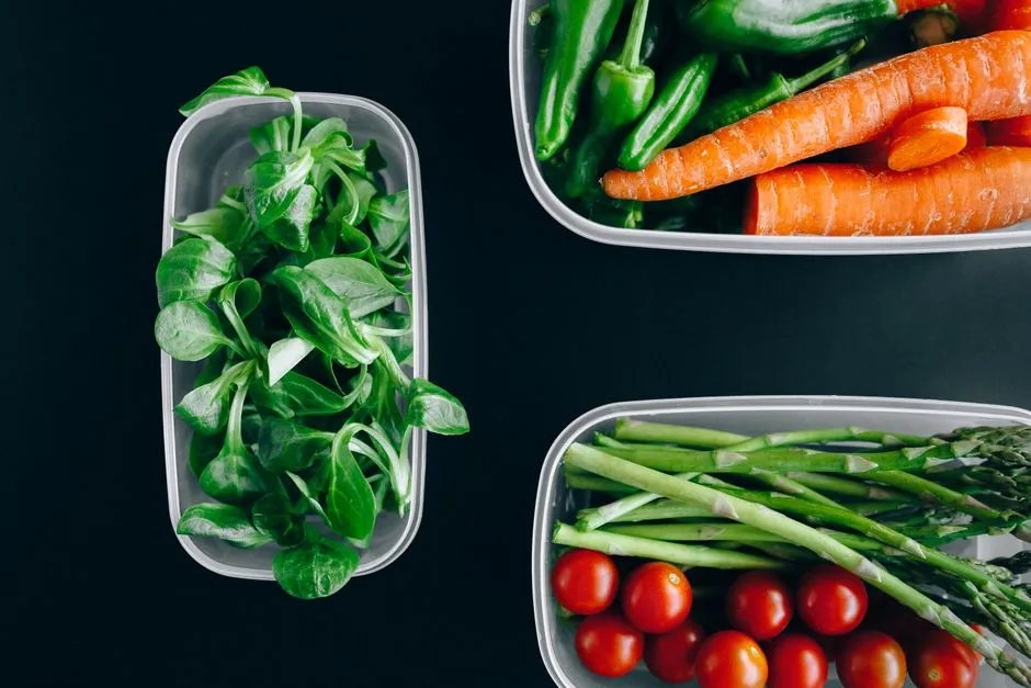 Weekly meal-prep containers with prepared food in a kitchen