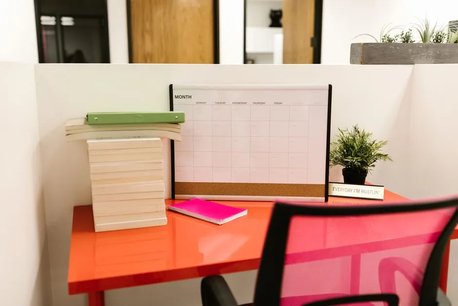 A ring binder with organized dividers on a home desk