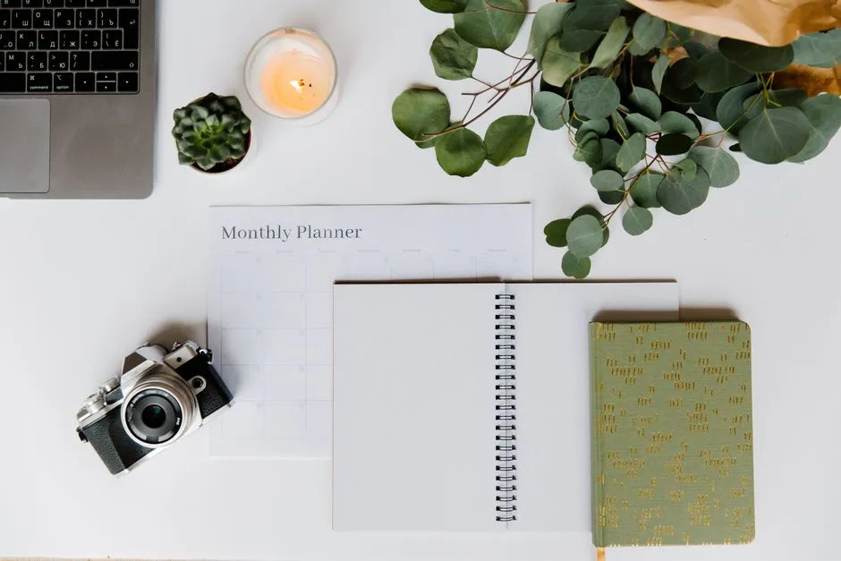 A cozy desk with a planner notebook laid out flat